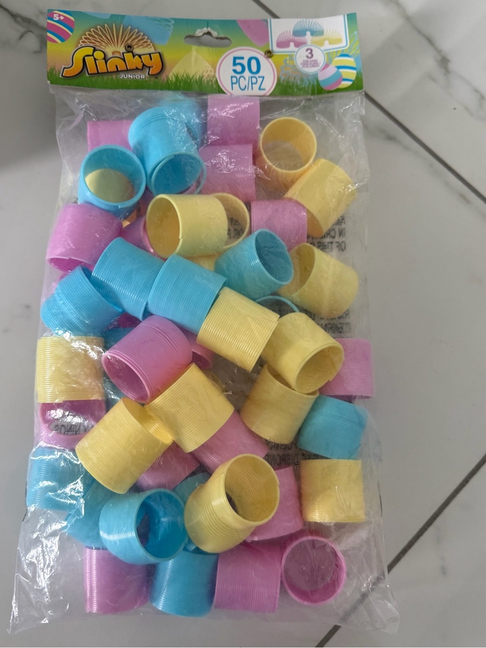 Mini plastic spring:50-pack of colorful, coil spring toys for party favors.
